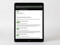 Digital kit displayed on device, featuring the Strengths-Based Coaching contents page.
