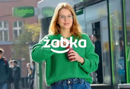 Woman in front of Zabka cafe