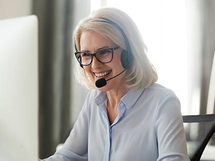 Person conducting a coaching conversation over the phone.